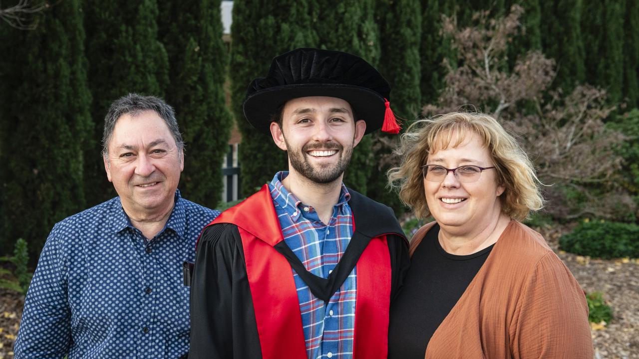 Doctor of Philosophy graduate Tom Porta with parents Vito and Dianne Porta at a UniSQ graduation ceremony at Empire Theatres, Wednesday, June 28, 2023. Picture: Kevin Farmer