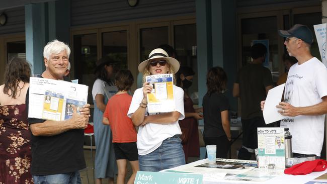 Mayoral candidate Bruce Clarke (left) and others welcome voters to the polling booths at the St Johns Multi Purpose Centre in Mullumbimby. Picture: Liana Boss