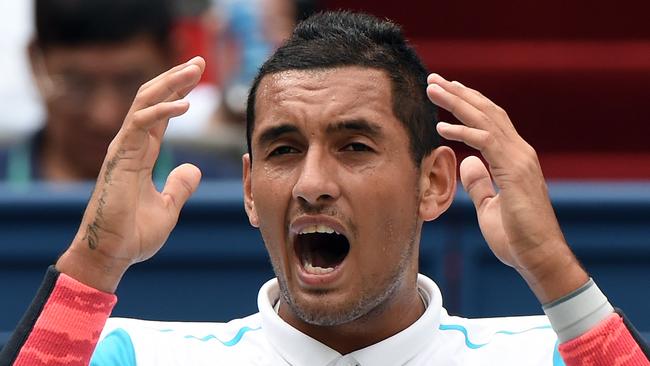 Nick Kyrgios of Australia reacts after talking with the umpire during a break in his men's singles second round match against Kei Nishikori of Japan at the Shanghai Masters tennis tournament in Shanghai on October 14, 2015. AFP PHOTO / GREG BAKER