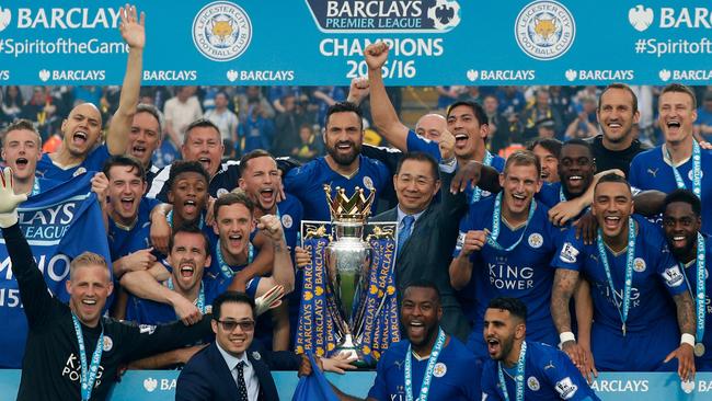 Leicester City owner Vichai Srivaddhanaprabha celebrates the 2015-16 premier league title with the players.