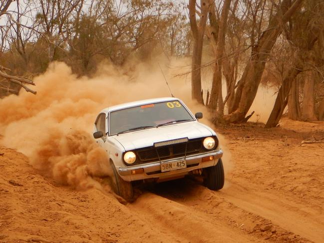 Steve and Lucas Dent plow through thick bull dust on a remote stretch of the Strzelecki Track.  Picture: Roderick Eime for SAWeekend piece on annual Rotary Club Corolla Caper