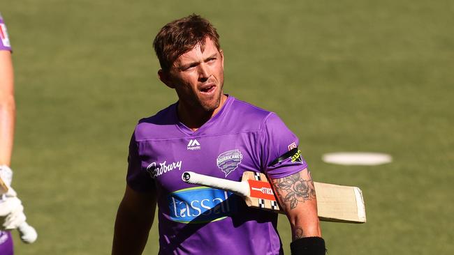 PERTH, AUSTRALIA - JANUARY 12: Ben McDermott of the Hurricanes walks from the field after being dismissed by JhyeÃÂ RichardsonÃÂ of the Scorchers during the Big Bash League match between the Perth Scorchers and the Hobart Hurricanes at Optus Stadium, on January 12, 2021, in Perth, Australia. (Photo by Paul Kane/Getty Images)