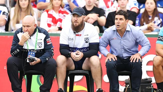 Former Bulldogs coach Trent Barrett (R) sits next to high performance manager Dan Ferris (C). Picture: Mark Kolbe/Getty