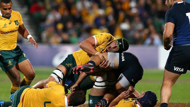 Wallabies lock Adam Coleman tackles Agustin Creevy of Argentina during Saturday night’s Test in Perth.