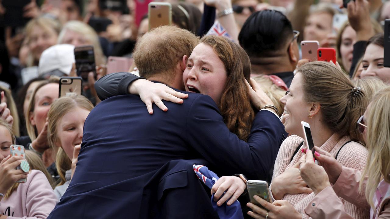 Harry has taken time to talk to fans throughout the tour and comforted this girl when she broke down in the Sydney crowd. Picture: Phil Noble/AP