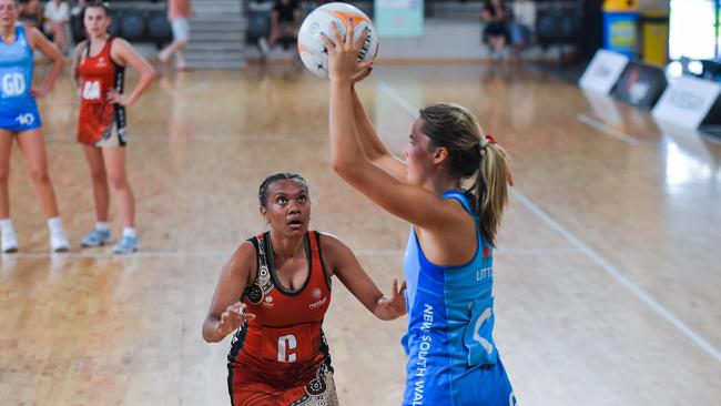 The NT’s Kiera Heffernan eyes off the ball held by NSW’s Eugenie Little in the 2023 National Netball Championships. Picture: Pema Tamang Pakhrin