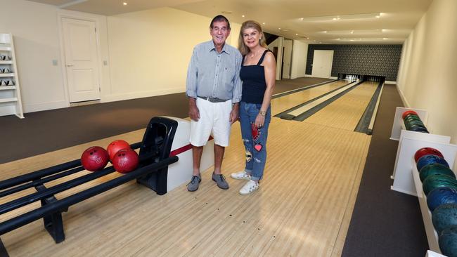 Frank and Lynne Mallan in the bowling alley of their former home in Hamilton.