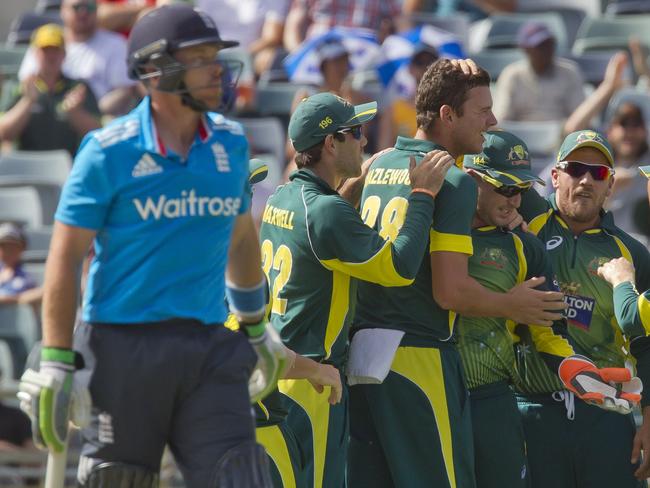 Josh Hazlewood is mobbed by his teammates after removing Ian Bell in the final at the WACA.