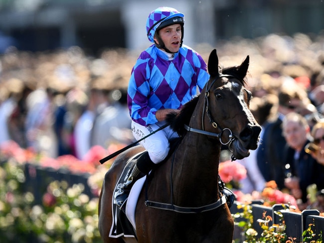 MELBOURNE, AUSTRALIA - NOVEMBER 11: Declan Bates riding Pride of Jenni wins the Kennedy Champions Mile during Stakes Day at Flemington Racecourse on November 11, 2023 in Melbourne, Australia. (Photo by Josh Chadwick/Getty Images)