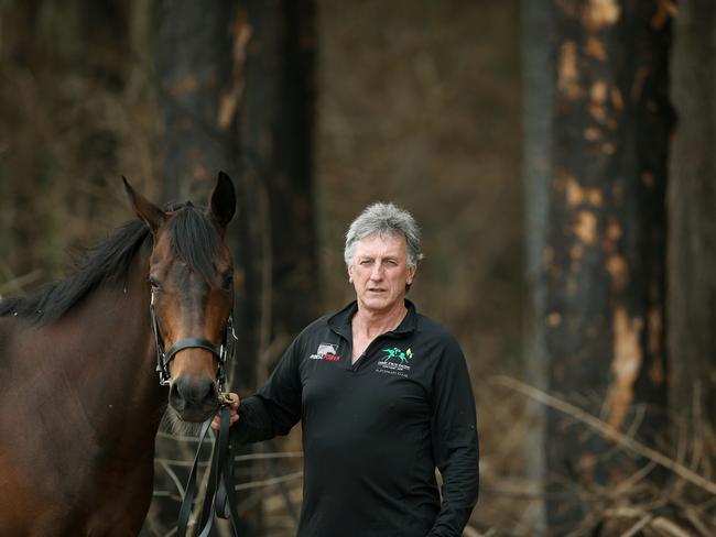 Evans was confronted by a wall of fire 20m from his stables on track at Tuncurry racecourse. Picture: Peter Lorimer