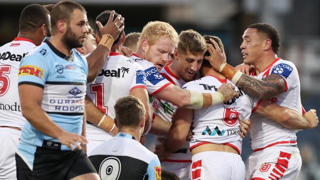 The Dragons celebrate Ben Hunt's try during the Round 5 NRL match between the St. George Illawarra Dragons and the Cronulla Sutherland Sharks at Campbelltown Stadium in Sydney, Sunday, June 14, 2020. (AAP Image/Brendon Thorne) NO ARCHIVING, EDITORIAL USE ONLY