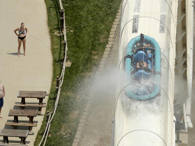 Riders are propelled by jets of water as they go over a hump while riding the Verruckt. Picture: Charlie Riedel/AP.