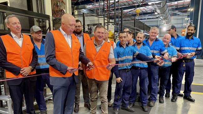 Peter Dutton and Wide Bay MP Llew O'Brien cut the ribbon at the opening of the Nioa-Rheinmetall munitions factory in Maryborough.