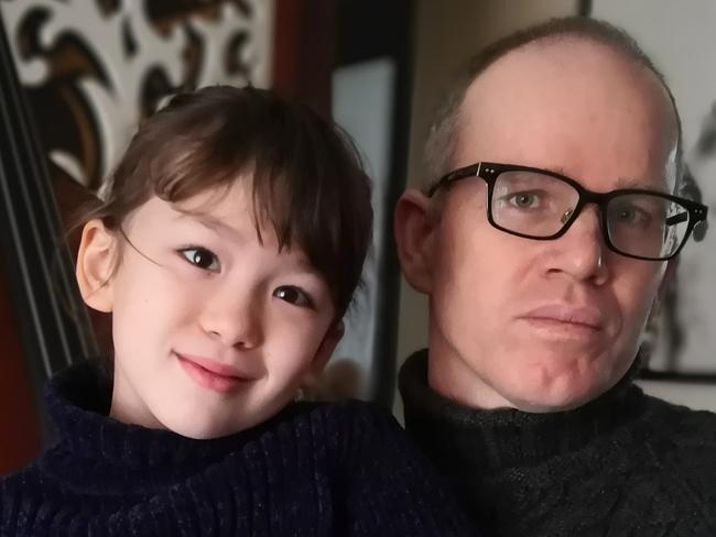 Australian Simon Carter and daughter Imogen in their flat in Wuhan, China.   Supplied