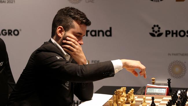 Ian Nepomniachtchi makes a move during the match against Magnus Carlsen . Picture: AFP