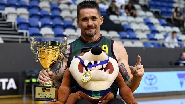 MELBOURNE, AUSTRALIA - NOVEMBER 05: Trent Johnson of Tasmania poses with the premiership cup after winning the Division 2 Grand Final match between Tasmania and NSW/ACT during the 2023 Toyota AFL Wheelchair National Championships Grand Final Day at State Netball Hockey Centre on November 05, 2023 in Melbourne, Australia. (Photo by Josh Chadwick/AFL Photos/via Getty Images)