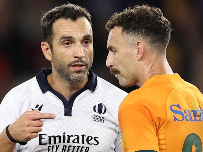 MELBOURNE, AUSTRALIA - SEPTEMBER 15: Referee Mathieu Raynal speaks to Nic White of the Wallabies during The Rugby Championship & Bledisloe Cup match between the Australia Wallabies and the New Zealand All Blacks at Marvel Stadium on September 15, 2022 in Melbourne, Australia. (Photo by Cameron Spencer/Getty Images)