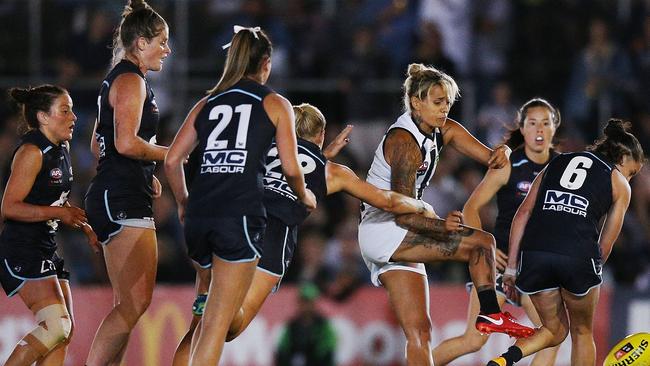 Carlton players swamp Collingwood forward Moana Hope. Picture: Getty Images