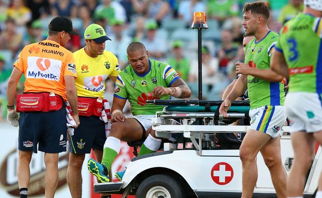 BJ Leilua of the Raiders is taken from the field with an ankle injury.