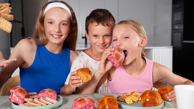 New Hot Cross Bun flavours., Ella 11 (blue top), Ava 9 (pink top), Tommy 5, Grandma Deb 71.Picture Rebecca Michael.