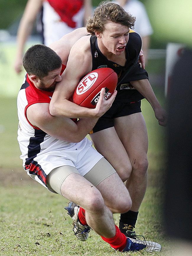 Happy Valley's Nick Frisby-Smith, pictured trying to break a tackle, was one of Happy Valley’s best at the weekend. Picture: Bianca De Marchi