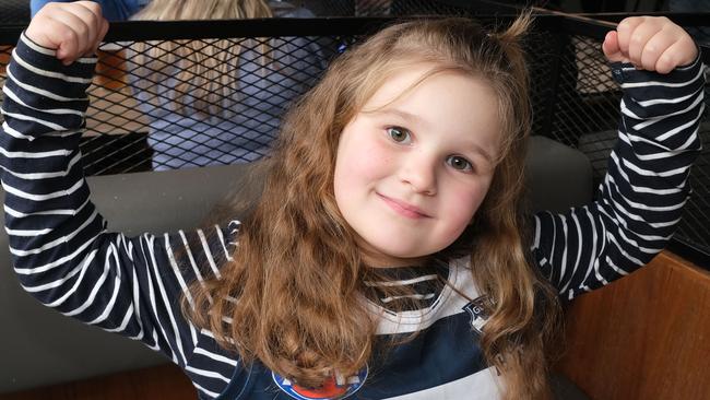 Geelong Cats fan Lilly, 7, is confident the Cats will have success against Brisbane. Picture: Mark Wilson