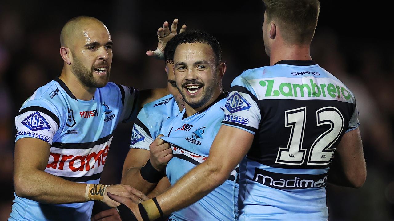 SYDNEY, AUSTRALIA - AUGUST 03: Braydon Trindall of the Sharks celebrates scoring a try during the round 22 NRL match between Cronulla Sharks and South Sydney Rabbitohs at PointsBet Stadium, on August 03, 2024, in Sydney, Australia. (Photo by Jeremy Ng/Getty Images)