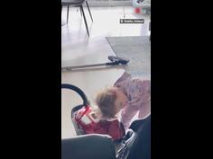 Little girl dries her hair using vacuum cleaner