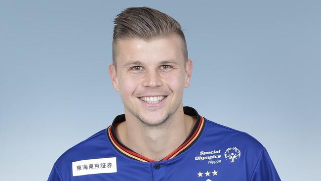 Bundaberg's Mitch Langerak poses with his new Nagoya Grampus jersey.