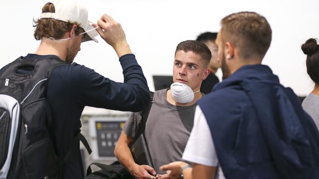 Wellington players Alex Rufer, left, and Cameron Devlin prepare to fly to Sydney