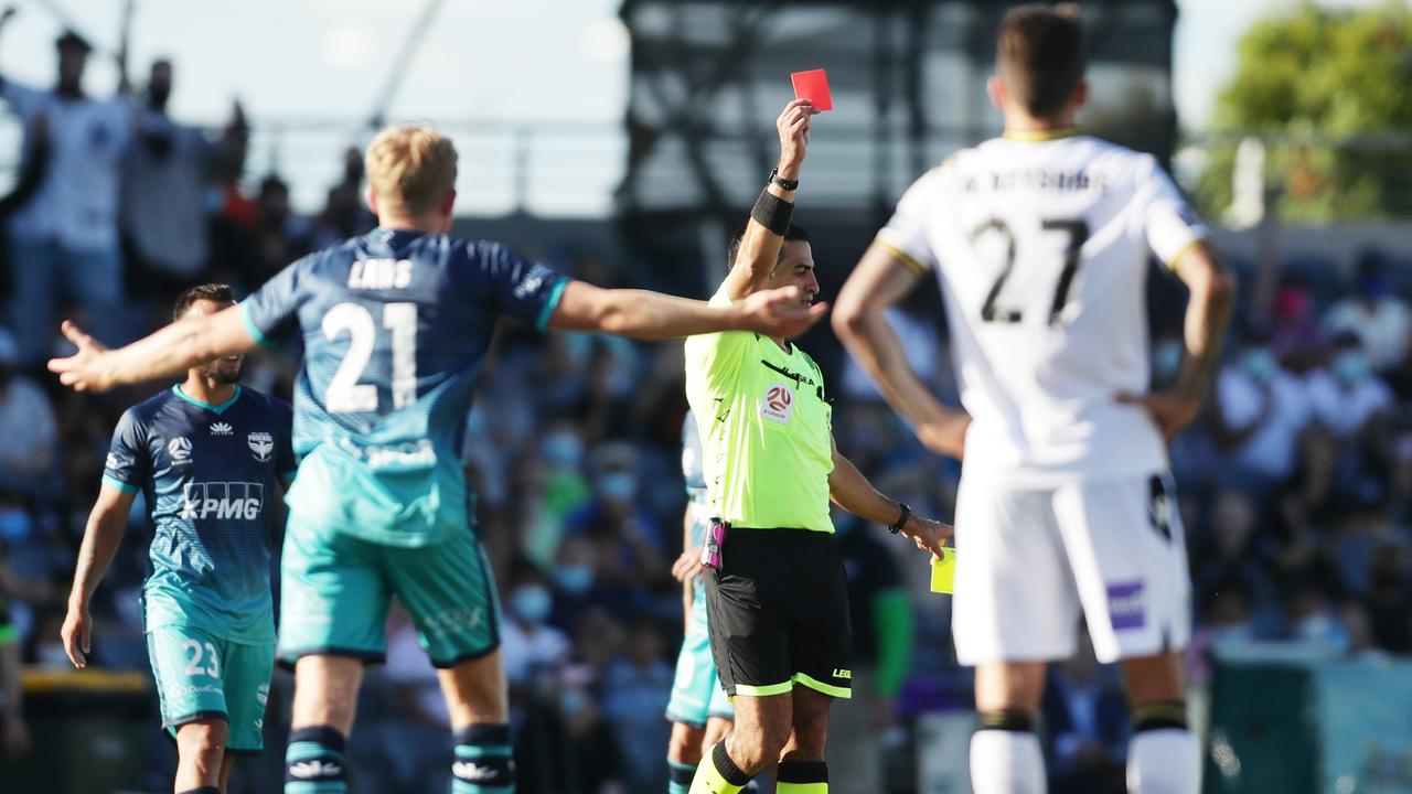 The referee shows a red card to Wellington’s Alex Rufer in their match against Macarthur FC.