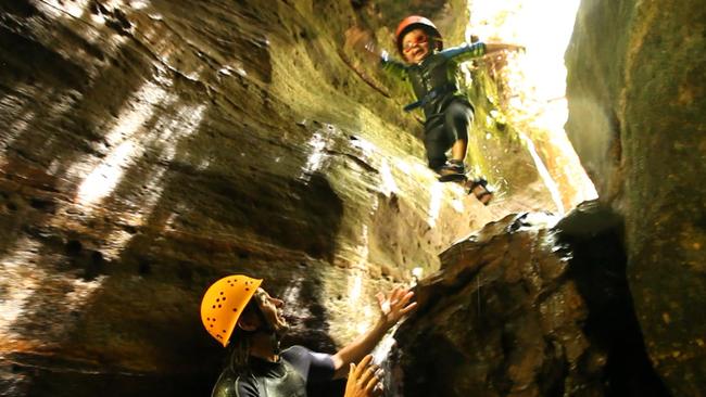 Leap of faith: Three-year-old Jack Castrission canyoning with his dad. <i>Picture: Channel 7</i>