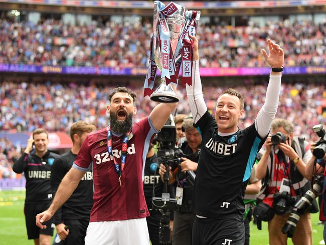 Mile Jedinak (L) is weighing up interest from several English clubs after being released by Aston Villa. Picture: Mike Hewitt/Getty Images