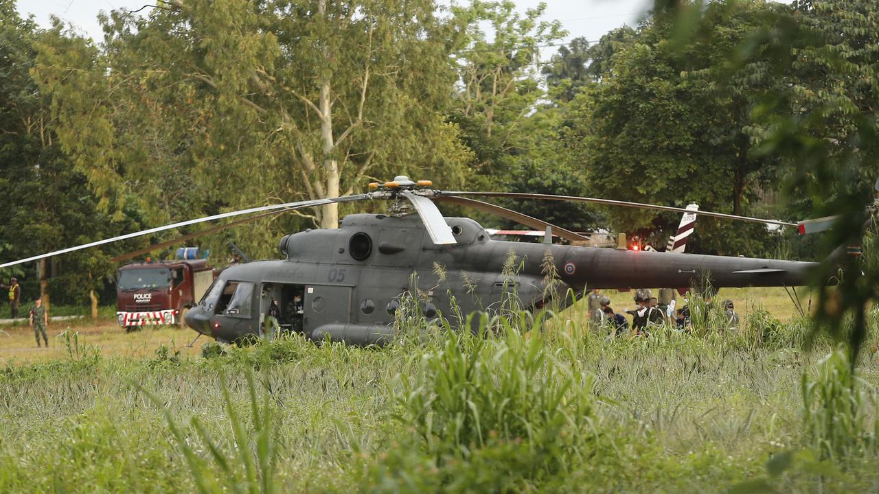 A Thai military evacuation helicopter arrives to help rescue the remaining trapped boys and their coach. Picture: AP Photo