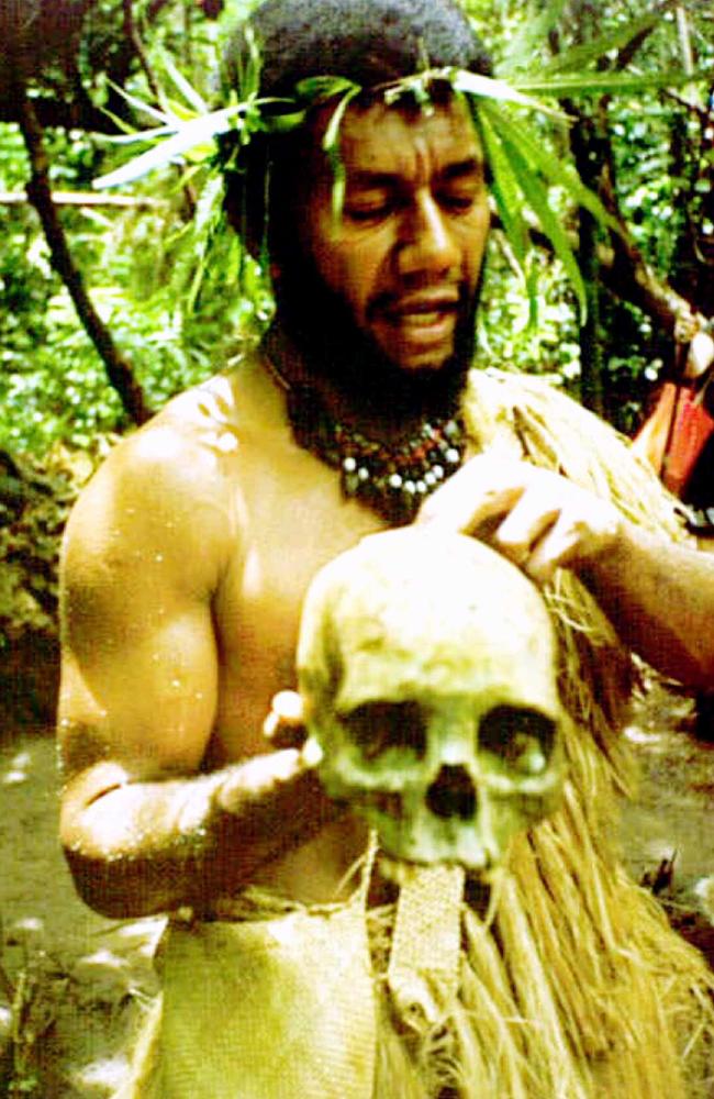 Johnson Sausiara shows off an old skull while telling tales of cannibalism in Vanuatu's past at the village of Ekasup near Port Vila.