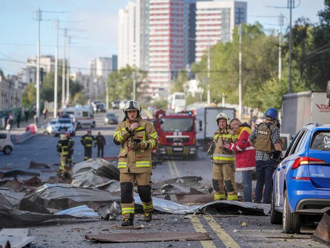 Ukrainian State Emergency Service rescuers working following strikes on the Ukrainian capital of Kyiv, amid Russia's invasion of Ukraine. Picture: AFP/State Emergency Services of Ukraine