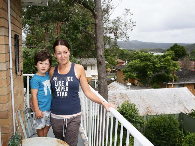 Monique Anderson, with her son Ashton, 4, is concerned that a nine story development will tower over her unit and block the light, at Point Frederick. Picture: Peter Clark