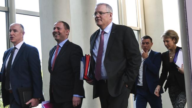 Scott Morrison and Josh Frydenberg leave after the partyroom meeting. Picture: AAP.