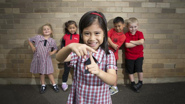 Gindarah Russell, Fengyu He, Angela Alba (front), Cheny Kepu and Riley Rae from Sarah Redfern Primary School tell us it’s Minto with a “T”. Picture: Melvyn Knipe