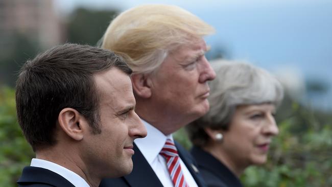 French President Emmanuel Macron, US President Donald Trump and Britain's Prime Minister Theresa May attending the G7 in Sicily.