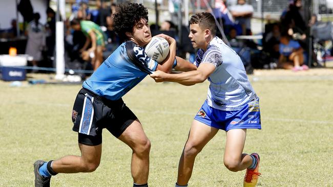 Santiago Uata of Maori is tackled by Jaylin Moran from NSW Indigenous. Under 16 boys NSW Indigenous v Maori Blue. Harmony Nines Rugby League. Picture: John Appleyard