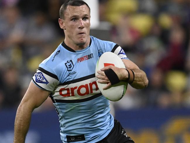 TOWNSVILLE, AUSTRALIA - AUGUST 17: Connor Tracey of the Sharks runs the ball during the round 25 NRL match between North Queensland Cowboys and Cronulla Sharks at Qld Country Bank Stadium on August 17, 2023 in Townsville, Australia. (Photo by Ian Hitchcock/Getty Images)