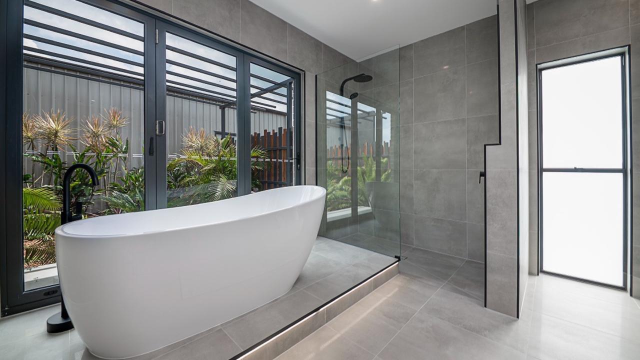 Hughes Elite Builders award-winning bathroom offers views of the garden while inside the luxurious bathtub. Photo: Hughes Elite Builders