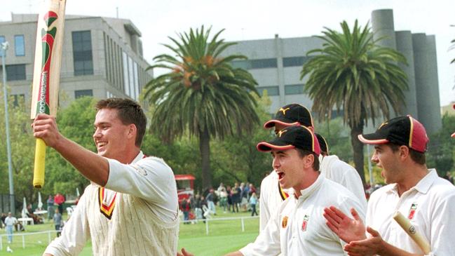 St Kilda's Nick Jewell (left) leads his teammates from the field after securing a four-wicket victory.