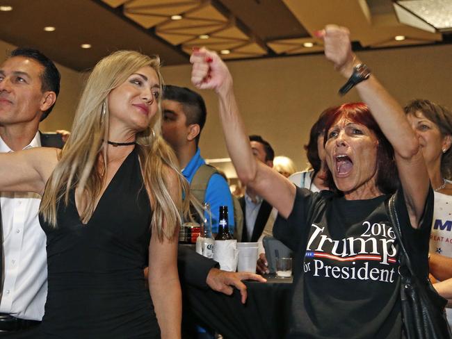 Supporters for Republican presidential candidate Donald Trump celebrate late returns against Democratic candidate Hillary Clinton. Picture: Ross D. Franklin/AP