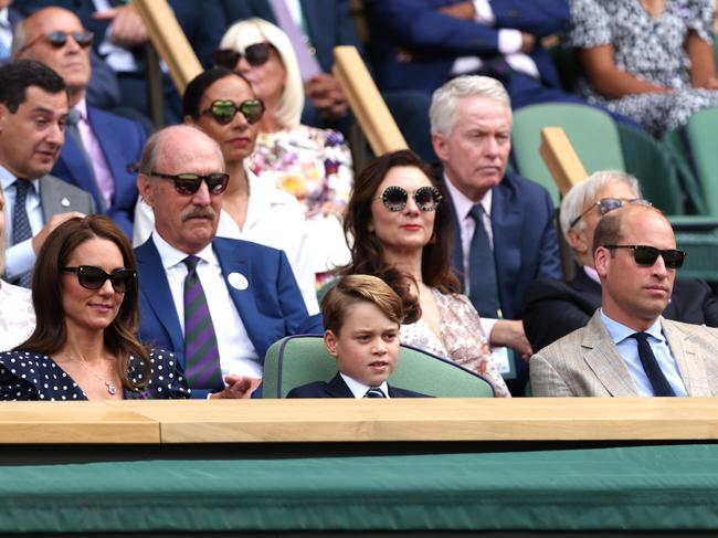 Kate and Prince William put on their shades as Prince George put up with the heat in a suit. Picture: Getty Images