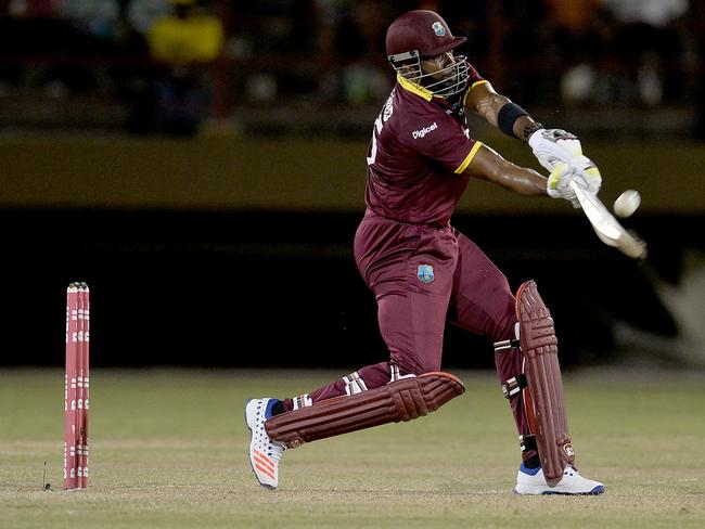 West Indie's Kieron Pollard plays a shot during the One-day International (ODI) cricket match between the West Indies and South Africa in the Tri-Nation Series in Georgetown, Guyana on June 3, 2016.  / AFP PHOTO / ANDREW CABALLERO-REYNOLDS