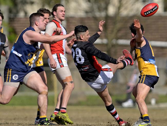 EFNL: North Ringwood’s Robin Nahas gets a kick away. Picture: Andy Brownbill