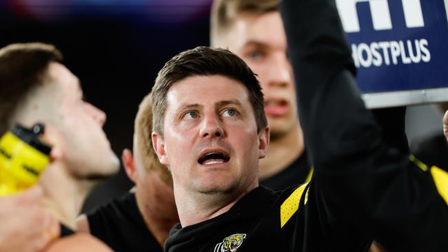 MELBOURNE, AUSTRALIA - AUGUST 4: Andrew McQualter, Interim Senior Coach of the Tigers addresses his players during the 2023 AFL Round 21 match between the Western Bulldogs and the Richmond Tigers at Marvel Stadium on August 4, 2023 in Melbourne, Australia. (Photo by Dylan Burns/AFL Photos via Getty Images)