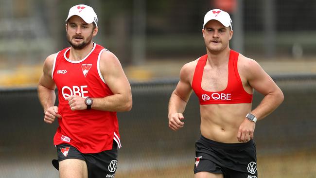 New recruit Sam Gray, left, runs with Tom Papley at Swans pre-season training. Picture: Phil Hillyard